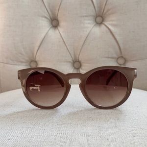 Taupe sunglasses. Round
